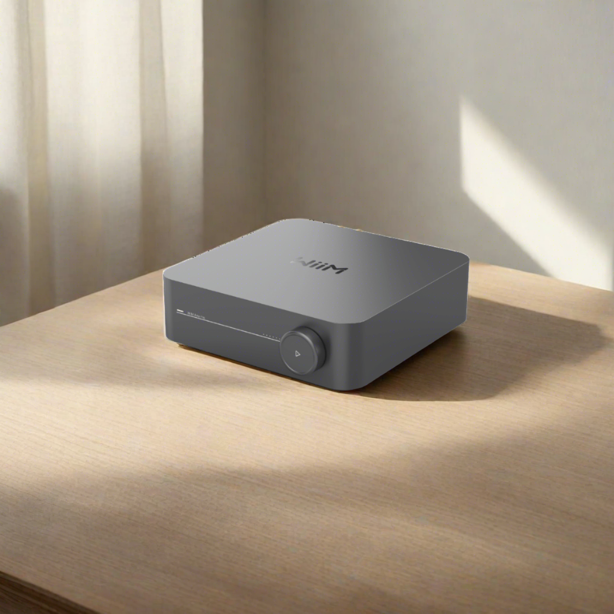Wiim Amp Pro Multiroom Stereo Streaming Amplifier on table